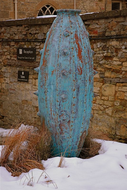 Giant verdigris pot in the snow