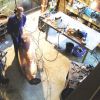 Michael Chaikin in studio with giant verdigris pot in early stages of construction