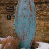 Giant verdigris pot in the snow