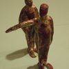 two figures, one pointing