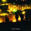 photograph of figures on acetate, stuck to a window and re-photographed on my window with view of city landscape at night
