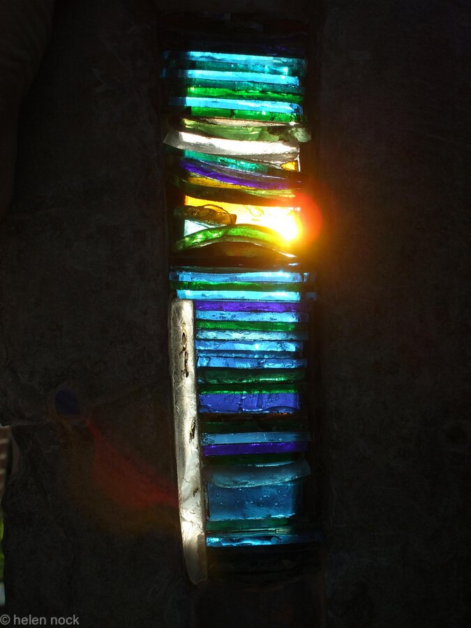 Light Blessings, Arrow-slit design stained glass window feature for exterior wall