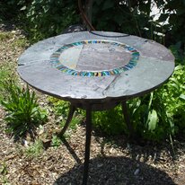 Wave Circle Design: hand made garden table on traditionally forged iron base