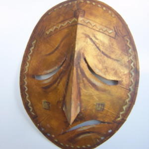 African sculpture style mask - sad face