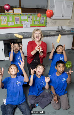 Berenice Bonallack photographed with the kids she is teaching to cook for Yours magazine
