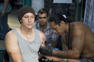 Man recieving a Samoan tattoo. London Tattoo Convention
