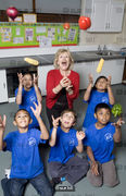 Berenice Bonallack photographed with the kids she is teaching to cook for Yours magazine