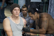 Man recieving a Samoan tattoo. London Tattoo Convention