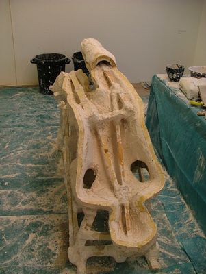 Front half of the mould is filled with plaster (1 inch thick) whitch is strengthened by a wooden skeleton.