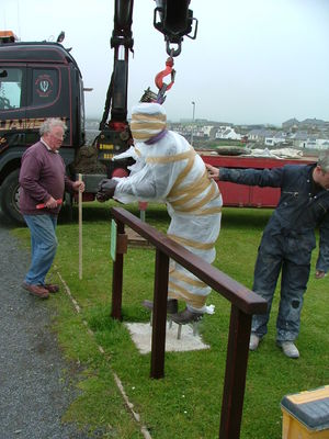 Bronze is lowered into place.