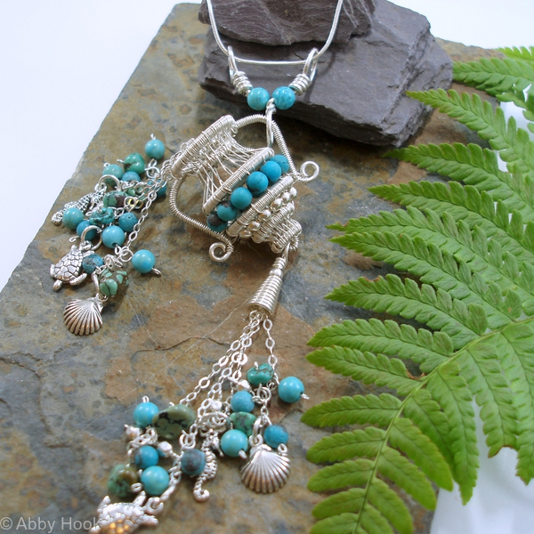 The Water Carrier tassel pendant