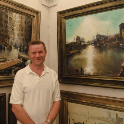 Artist with Paintings