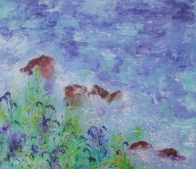 Bluebells and spurge appear to touch the ocean