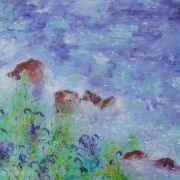 Bluebells and spurge appear to touch the ocean